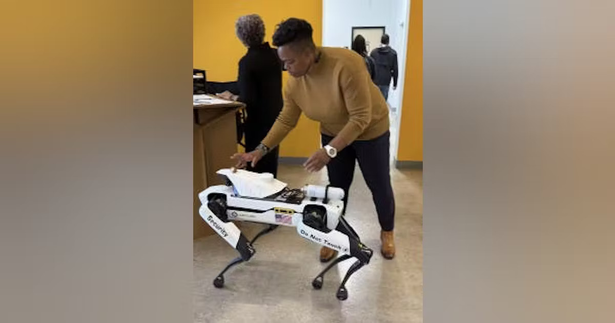 Image Courtesy: Public Domain : Skylar CEO Jamine Moton with the DroneDog by Asylon Robotics.