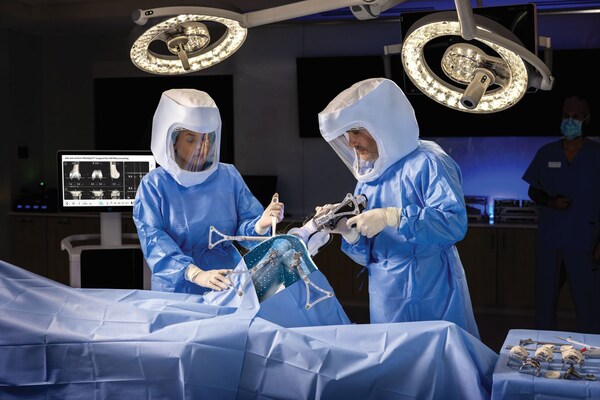 Image Courtesy: Public Domain : Two surgeons performing total knee arthroplasty in an OR utilizing the VELYS™ robotic assisted technology.